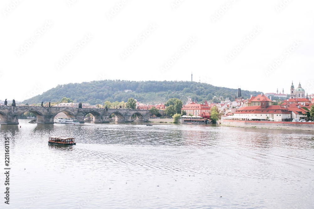Obraz premium Scene in the photo of the river Vltava, Prague, Czech Republic, Charles Bridge and the old historical architecture. Beautiful landscape of Prague