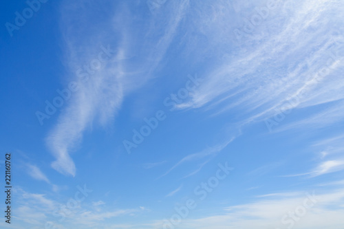 White feather clouds in blue sky as background (copy space)