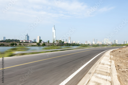 empty asphalt highway through modern city © zhu difeng
