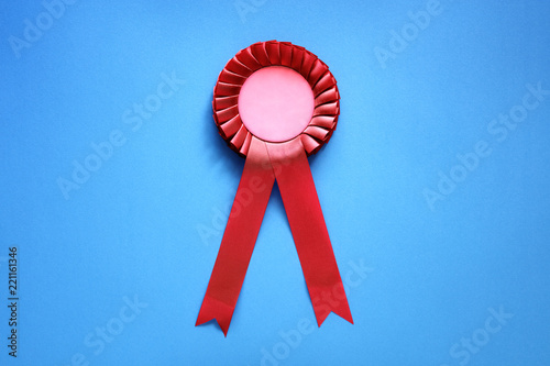 Red award rosette with ribbons