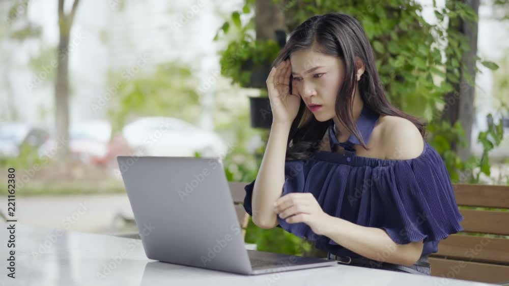 stressed woman using laptop computer stressed woman using laptop computer