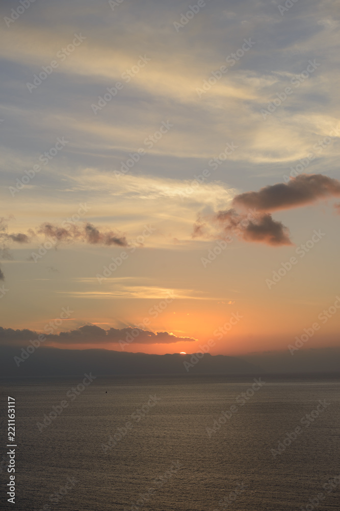 Sunset in the clouds over Gomera Island, Tenerife, Canary, Spain.