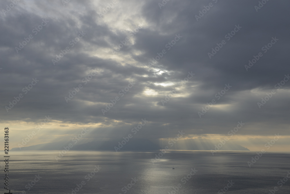 Sunrays through the clouds over Gomera Island.