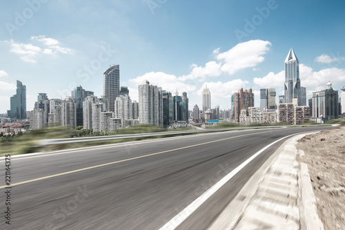 empty asphalt highway through modern city © zhu difeng