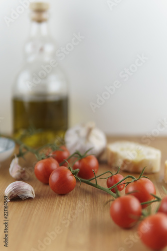 Mediterranean food: tomatoes, garlic, salt, olive oil and bread