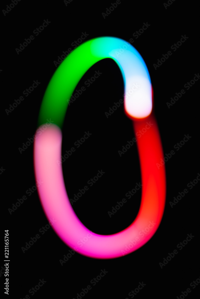 Letter O. Glowing letters on dark background. Abstract light painting at night. Creative artistic colorful bokeh. New Year. Use it for build you own design for book cover, CD, poster or post card. Letter O. Glowing letters on dark background. Abstract light painting at night. Creative artistic colorful bokeh. New Year. Use it for build you own design for book cover, CD, poster or post card.