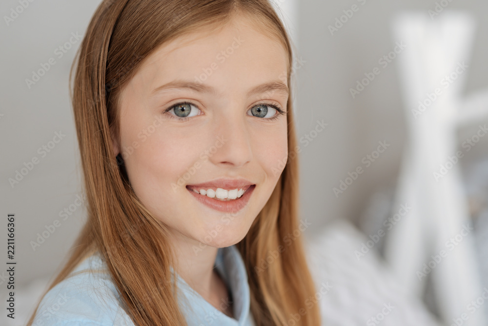 Facial expressions. Kind girl feeling happiness while looking forward, dreaming about celebration Facial expressions. Kind girl feeling happiness while looking forward, dreaming about celebration