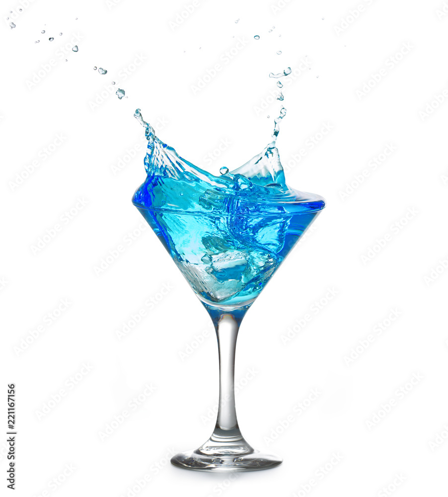 blue cocktail splashing out of a glass isolated on white background