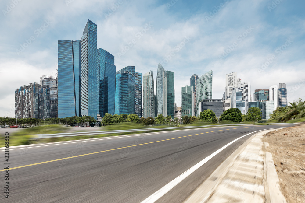 empty asphalt highway through modern city