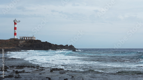 Faro de Punta Rasca or Punta Rasca Lighthouse situated in Palm Mar and reached by a stroll across the volcanic badlands, Tenerife, Canary Islands, Spain