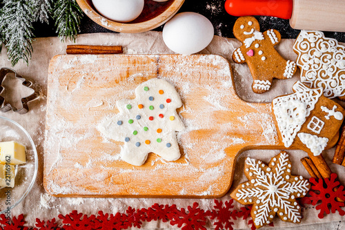 Fototapeta Naklejka Na Ścianę i Meble -  cooking christmas gingerbread on wooden background top view