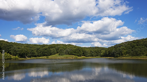 clouds reflected in a lake at Lone Elk Park near St. Louis, MO