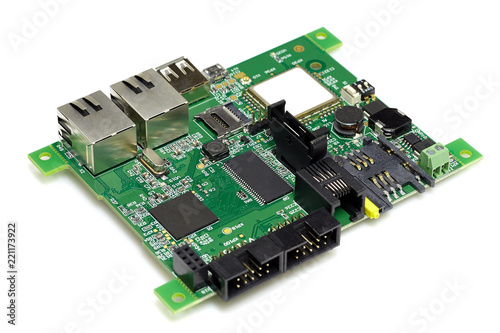 Electronic printed green circuit board with chips and other components, isolated on white background