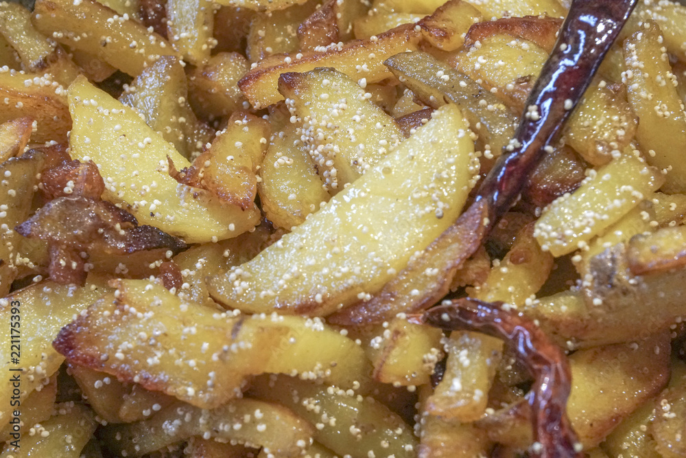 Fried potato pieces with fried red chilly Fried potato pieces with fried red chilly