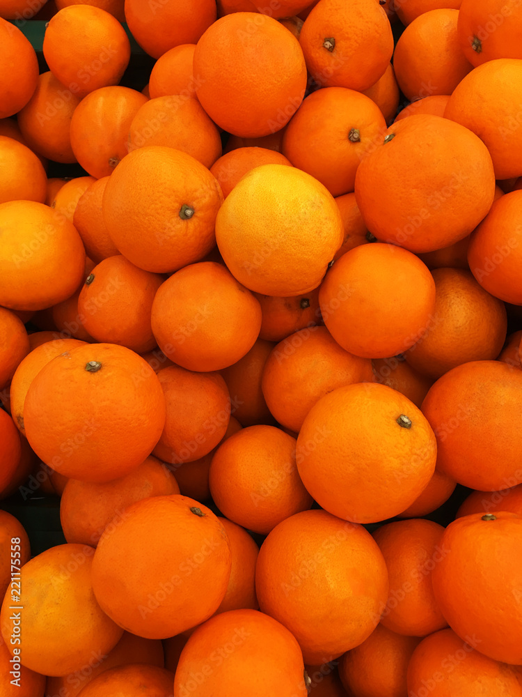 Healthy fruits, orange fruits background many orange fruits - orange fruit background in a supermarket super store