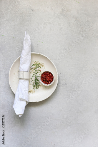 Table setting with spices and fresh herbs
