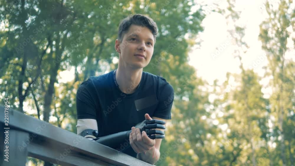 Man with a special bionic prosthetic hand. Human with a robot arm. Man with a special bionic prosthetic hand. Human with a robot arm.