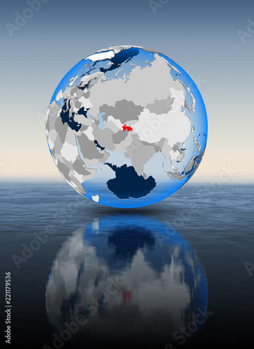 Tajikistan on globe in water