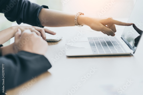 closeup businessman hand working with laptop with blur background