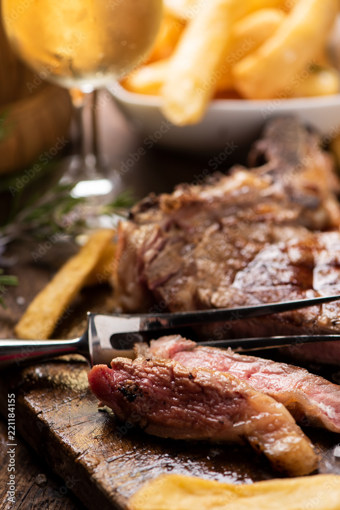 Grilled beef steak on cutting board