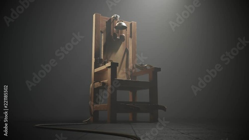 Wooden electric chair in the foggy room spotlight. Camera slow track in. 4K HD