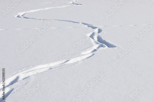 Zigzagging steps in snow.