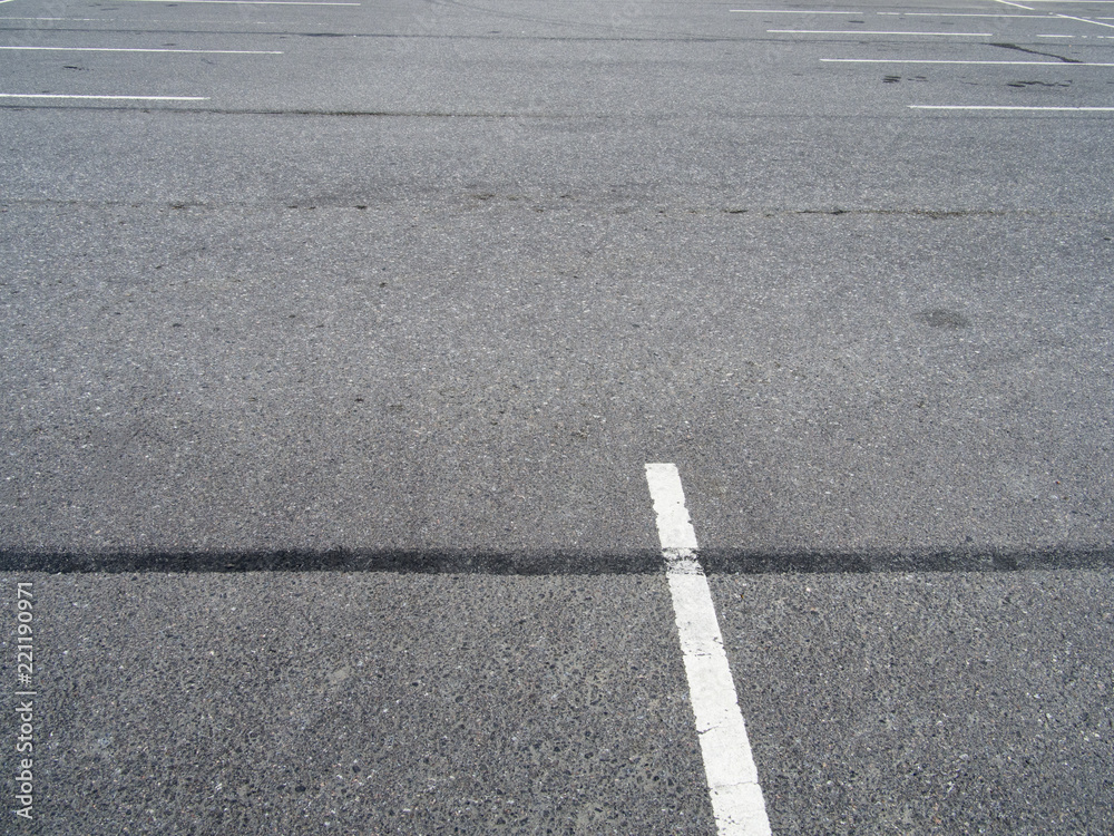 Empty parking lot at city center. The road surface.