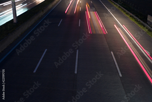 Three Red Taillights on the Freeway