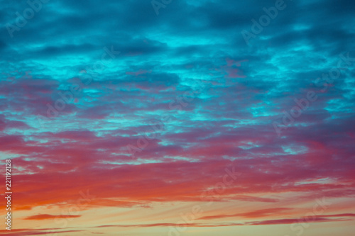 blue and orange sky clouds at sunset or sunrise.