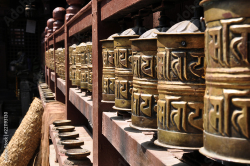 Buddhist prayer wheels in motion at the temple of Swayambhunath or monkey temple, Kathmandu, Nepal