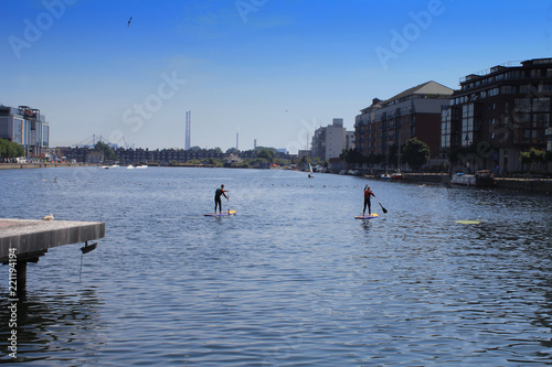 Stand up Paddle Boarding in Grand Canal Dock, Dublin, Ireland. photo