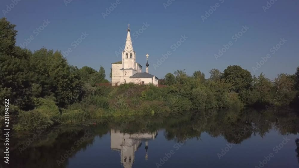 Flight over the river and beautiful church in Suzdal Flight over the river and beautiful church in Suzdal