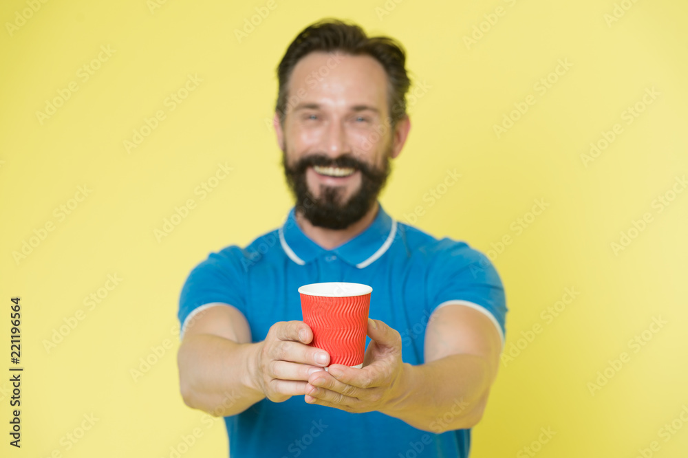 Guy beard and mustache holds paper cup of tea or coffee. Offer drink to you. Trainer experienced man care about water balance. Share and generosity concept. Have a sip. Take this if you want to drink Guy beard and mustache holds paper cup of tea or coffee. Offer drink to you. Trainer experienced man care about water balance. Share and generosity concept. Have a sip. Take this if you want to drink