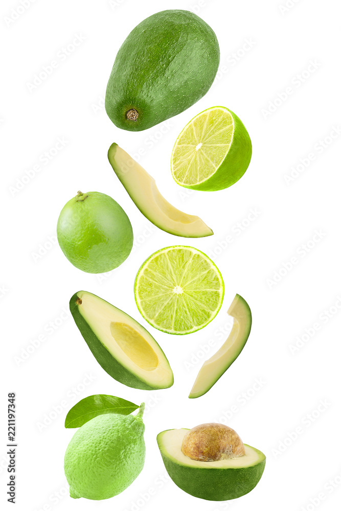 Falling avocado and lime isolated on white background
