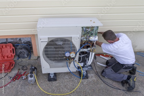 heat Pump. plumber at work installing a circulation heat pump