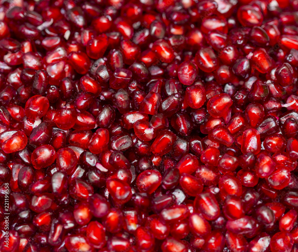 Red background of pomegranate seeds close-up Red background of pomegranate seeds close-up