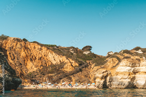 Tourists Having Fun In Water, Relaxing And Sunbathing On Praia do Camilo (Camel Beach) At Lagos In Algarve, Portugal