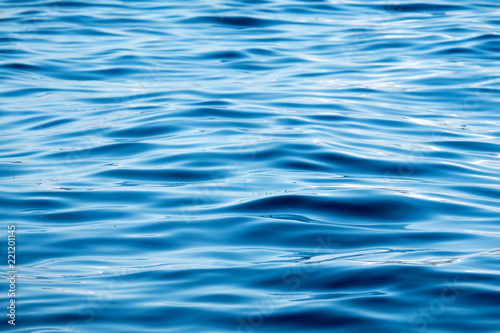 calm water surface with small ripples © olgavisavi