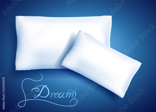 White pillows for sleeping and neon inscription "Dream"