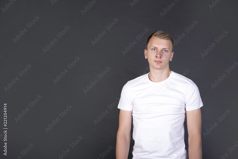 Man standing isolated on dark grey background Man standing isolated on dark grey background