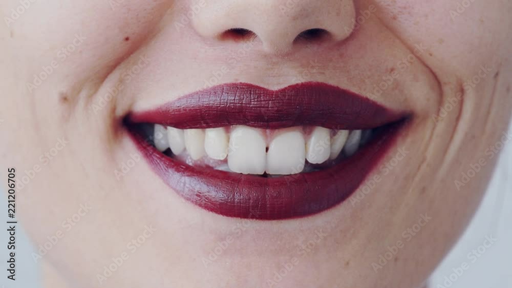 Woman's lips with red lipstick and kiss close up view Woman's lips with red lipstick and kiss close up view