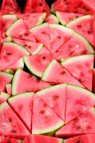Watermelon pattern. Many pieces of watermelon for company. Natural dessert for vegans. Healthy food to cleanse the body. Diet with diuretic
