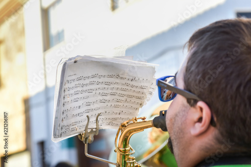 Detail of street music band at popular party. trumpeter
