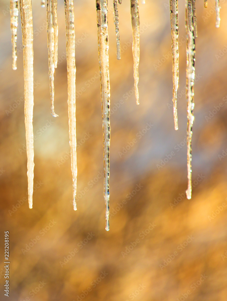 Fototapeta premium icicles hanging from the roof or pipes in winter