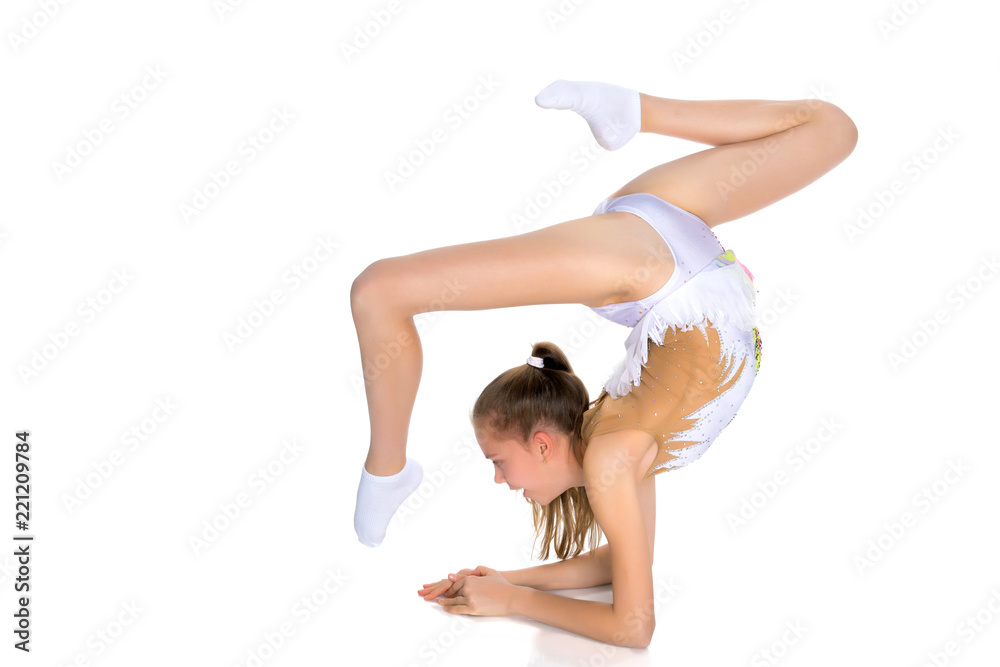 A gymnast performs an exercise stance on her forearms.