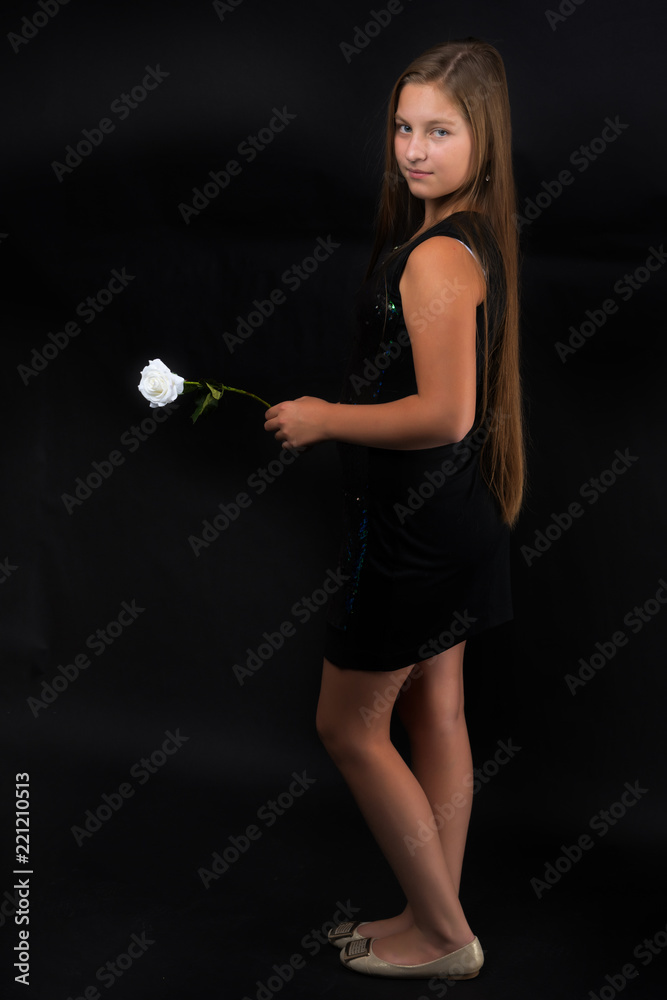 Teenage girl with a flower in her hand Teenage girl with a flower in her hand
