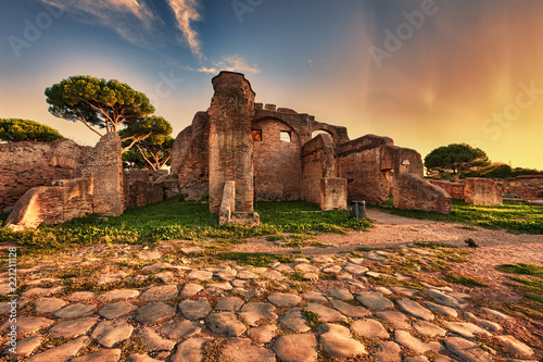 Sunset glimpse from cobblestones street in  Ancient Ostia ruins  - Rome