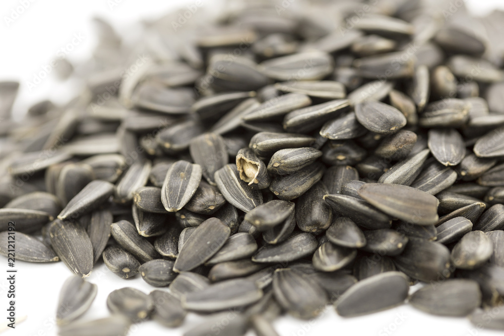 fried sunflower seeds on white background fried sunflower seeds on white background