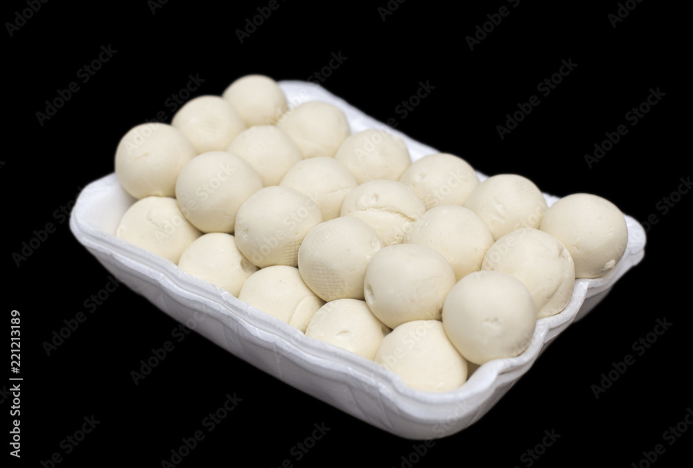 Kazakh national kurt or round solid milk isolated on a black background Kazakh national kurt or round solid milk isolated on a black background