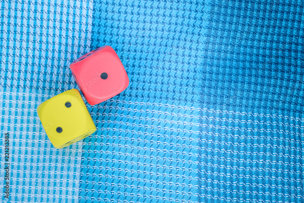 excitement and passion unlucky concept of game red and yellow blocks with small loosing numbers on blue carpet background texture with empty copy space for your text excitement and passion unlucky concept of game red and yellow blocks with small loosing numbers on blue carpet background texture with empty copy space for your text